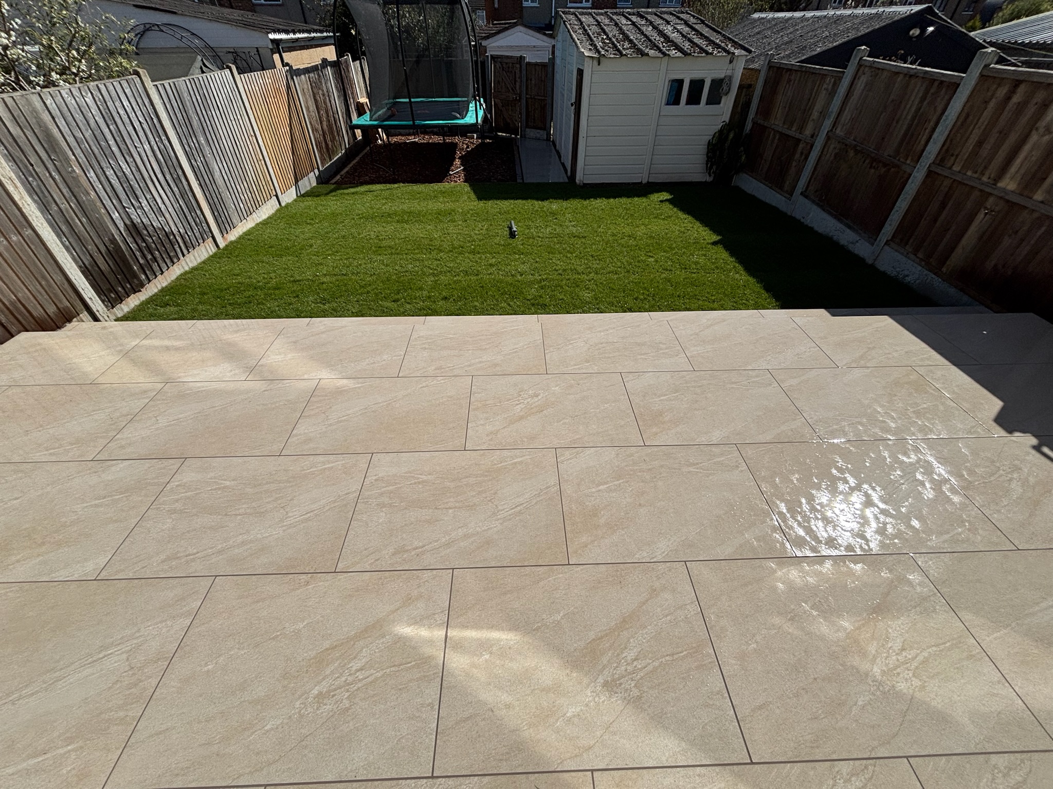 Lava Beige Porcelain Patio with Turf and Play Area finished photo 10